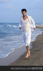 Latin young man white shirt walking on blue beach outdoor