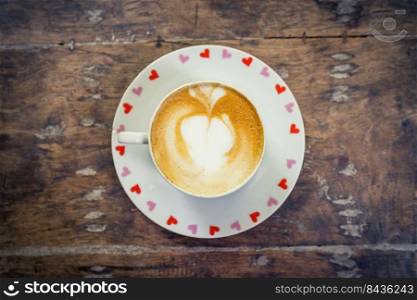 latte coffee on wood table with space