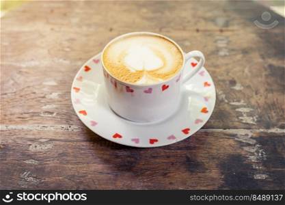 latte coffee on wood table with space