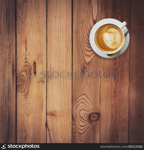 Latte coffee on wood with space