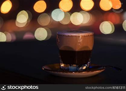 Latte coffee with bokeh background. Latte coffee at coffee shop and blur background with bokeh