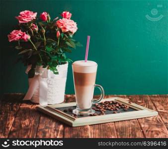 Latte on the chalking board tray, vintage still life. Latte on the tray