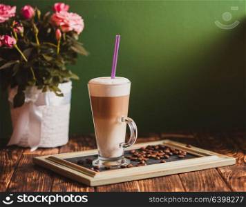 Latte on the chalking board tray, vintage still life. Latte on the tray