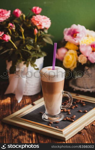 Latte on the chalking board tray, vintage still life. Latte on the tray