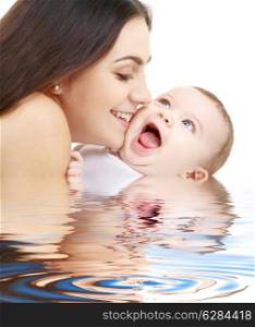 laughing baby with mother in water (focus on mama)