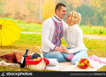 laughing beautiful couple spending time at the picnic