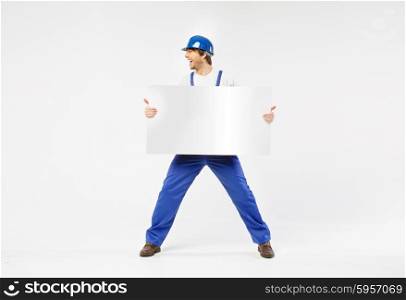 Laughing handsome builder with white board