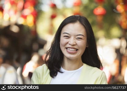 Laughing Mid Adult Woman In Nanluoguxiang, Beijing