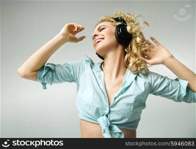 Laughing woman enjoying the realaxing music