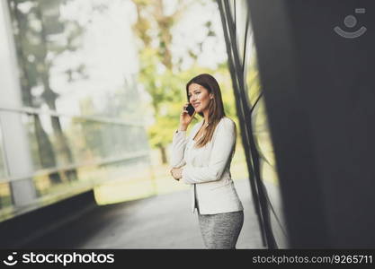 Laughing woman receiving tulips  flowers from her husband or partner smiling at him sitting on sofa