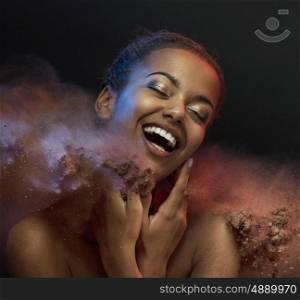 Laughing woman taking a dust bath