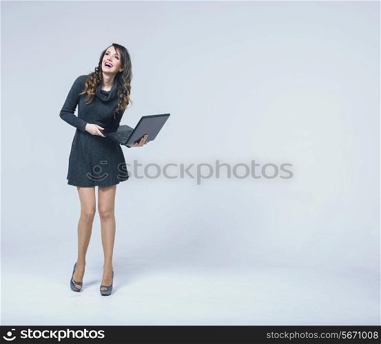 Laughing woman with black notebook