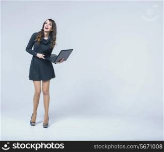 Laughing woman with black notebook