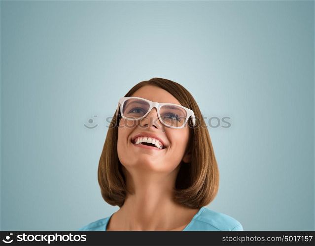 Laughing woman with good sense of humor smiling as she tilts her head back to look into the air