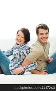 Laughing young couple having fun at home