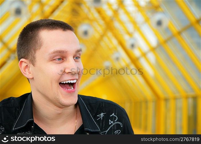 laughing young man in black shirt