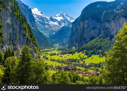 Lauterbrunnen valley, village of Lauterbrunnen, waterfalls and the Lauterbrunnen Wall in Swiss Alps, Switzerland.. Mountain village Lauterbrunnen, Switzerland