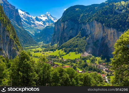 Lauterbrunnen valley, village of Lauterbrunnen, waterfalls and the Lauterbrunnen Wall in Swiss Alps, Switzerland.. Mountain village Lauterbrunnen, Switzerland