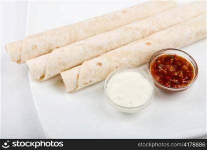 lavash tube with sauce on a white background