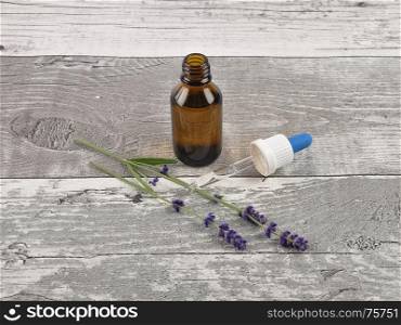 Lavender and essence on weathered wood