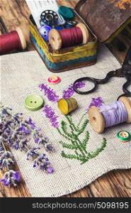 Lavender bouquet embroidery. Embroidery bouquet of lavender and tools of needlework