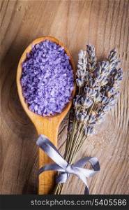 Lavender bunch and sea salt on the wooden table