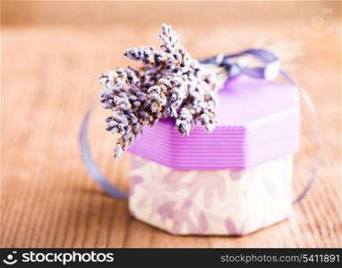 Lavender bunch on the wooden table closeup with box, shallow DOF