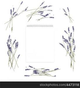 Lavender flowers and empty sketchbook. Floral frame from dried plants. Flat lay background