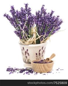 Lavender flowers and wooden mortar with bath salt over white background