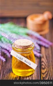 lavender oil in bottle and on a table