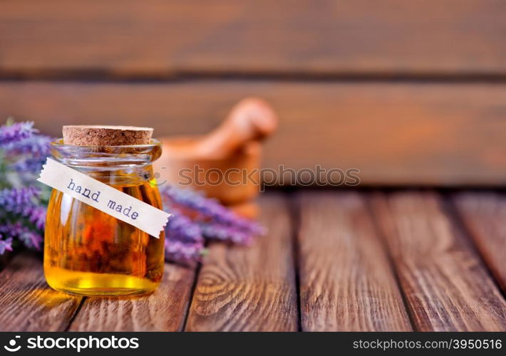 lavender oil in bottle and on a table