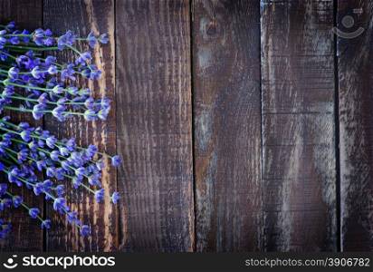 lavender on a table, flowers on the wooden background