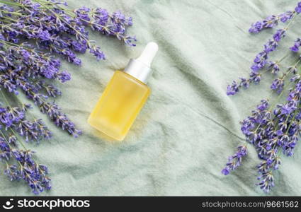 Lavender spa. Lavender  natural essential oil and fresh lavender on a textile background.