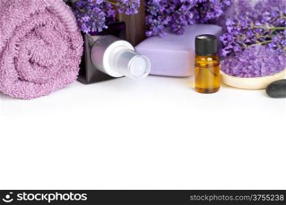 Lavender spa with flowers, oil, salt - beauty composition on white background with copy space