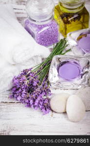 Lavender spa with rebbles, candles and white towels