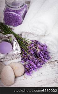 Lavender spa with rebbles, candles and white towels