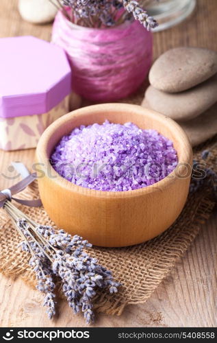 Lavender treatment soap and sea salt on wooden table