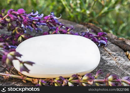 Lavender with soap on a wooden background. Soap for the face. Body care.. Lavender with soap on a wooden background. Soap for the face.