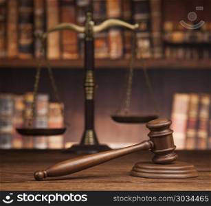 Law and justice concept, Brown wooden background. law theme, mallet of the judge, justice scale, books, wooden desk