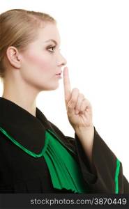Law court or justice concept. Woman lawyer barrister wearing classic polish black green gown asking for silence isolated. Finger on lips as quiet sign symbol gesture hand.