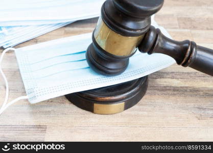 law gavel and face anti virus masks close up, medical law concept. medical law concept