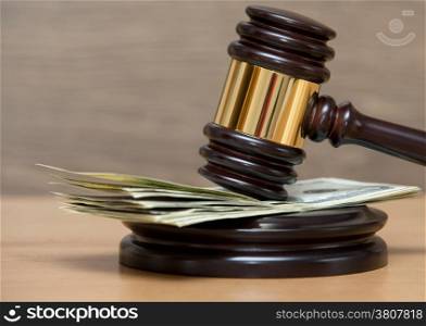 Law gavel on a stack of American money