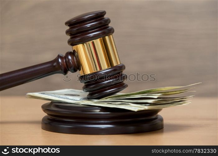 Law gavel on a stack of American money