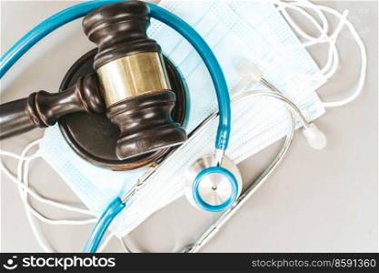 law gavel, stethoscope and face anti virus masks close up, medical law concept. medical law concept