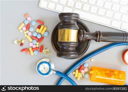 law gavel, stethoscope and pills, medical law concept, copy space. medical law concept
