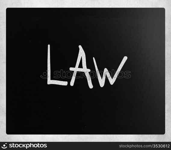 ""Law" handwritten with white chalk on a blackboard"