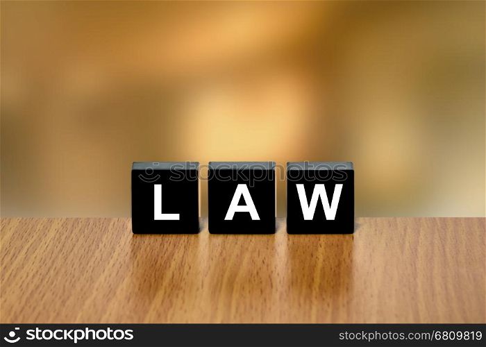 law on black block with blurred background