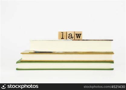 law word on wood stamps stack on books