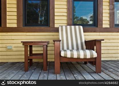 Lawn chair on a deck at a summer cottage