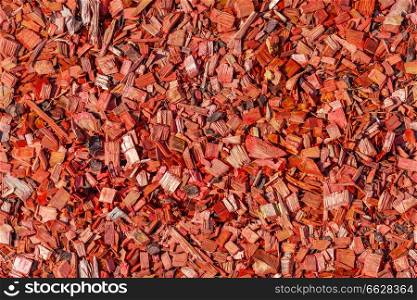 lawn strewed by red wooden chips, seamless texture